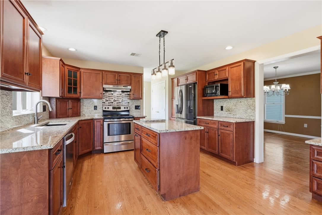 590 Fehr Road Nazareth, PA 18064 - Photo 17 of 79 Gleaming hardwood floors and stone countertops anchor this classic kitchen design.