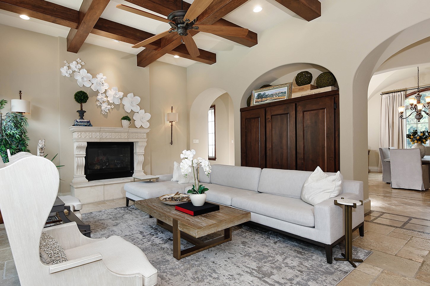 119 Angel Leaf Road The Woodlands, TX 77380 - Photo 10 of 50 a living room with furniture a fireplace and a chandelier