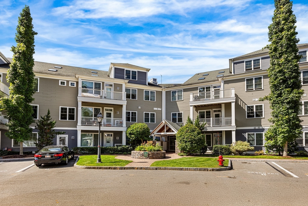 39 Taylor Drive, Unit 2006 Reading, MA 01867 - Photo 1 of 36 a view of street with a car parked in front of it