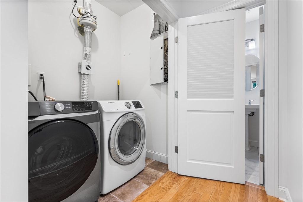 39 Taylor Drive, Unit 2006 Reading, MA 01867 - Photo 22 of 36 a utility room with dryer and washer