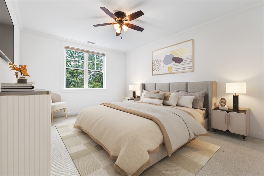 39 Taylor Drive, Unit 2006 Reading, MA 01867 - Photo 23 of 36 a bedroom with a large bed and a window