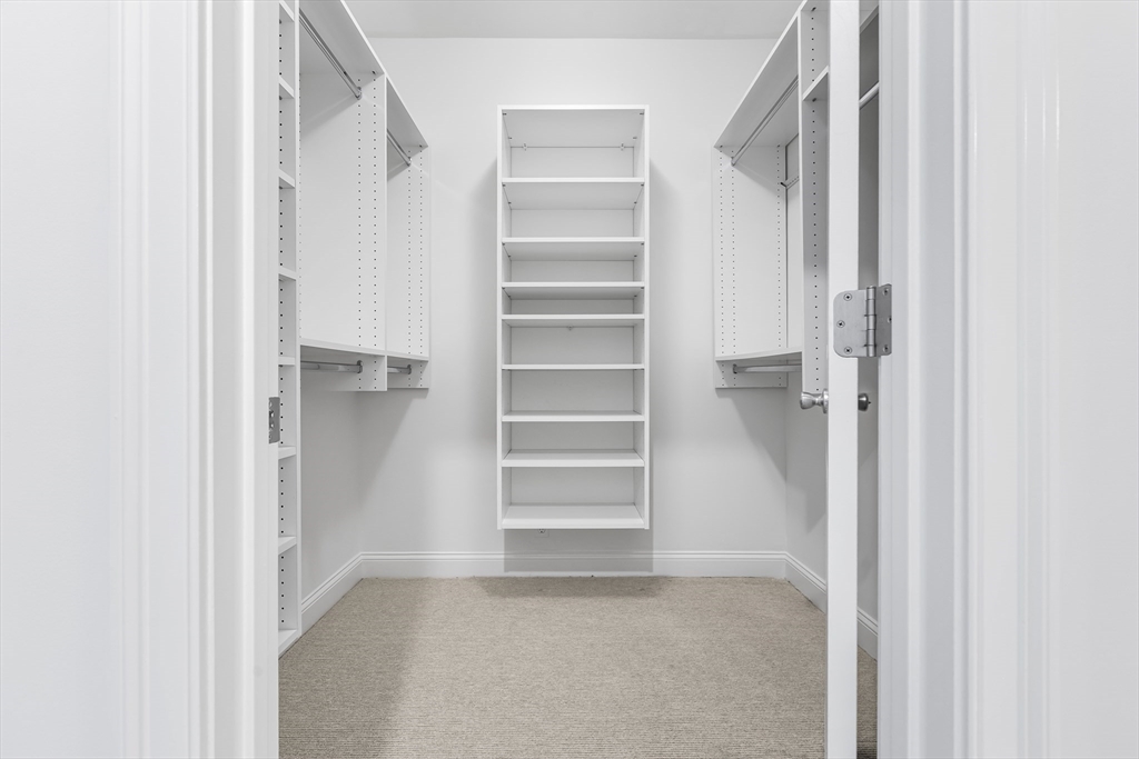 39 Taylor Drive, Unit 2006 Reading, MA 01867 - Photo 24 of 36 a view of walk in closet with empty racks