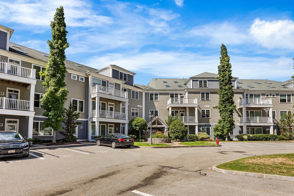 39 Taylor Drive, Unit 2006 Reading, MA 01867 - Photo 31 of 36 a front view of a building with street view