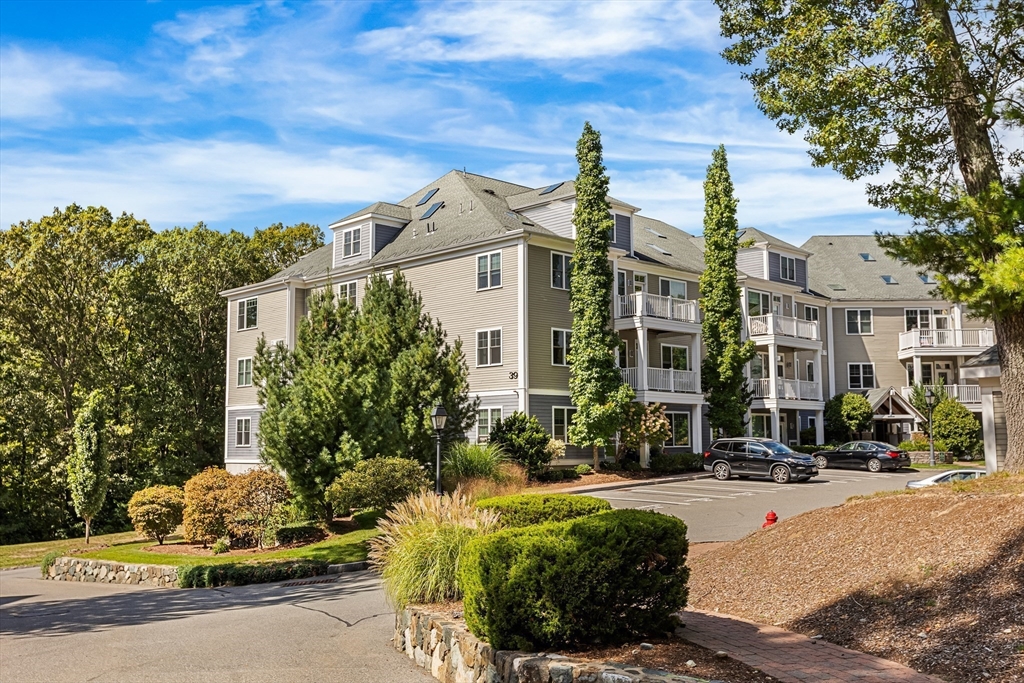 39 Taylor Drive, Unit 2006 Reading, MA 01867 - Photo 32 of 36 a front view of a building with street view