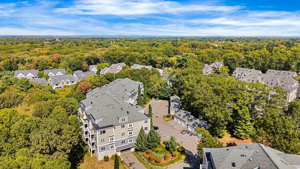39 Taylor Drive, Unit 2006 Reading, MA 01867 - Photo 33 of 36 an aerial view of a house with a lake view