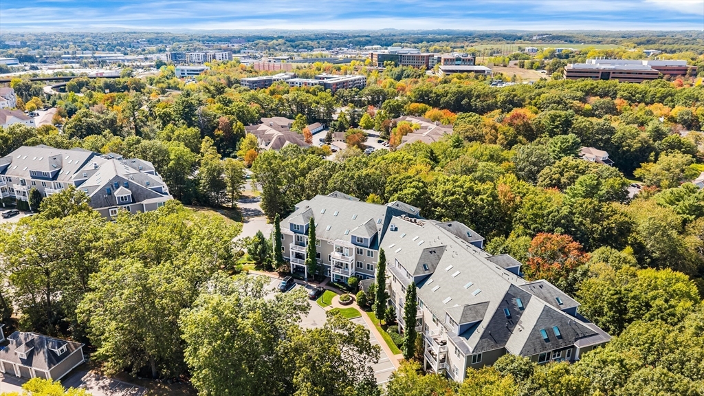 39 Taylor Drive, Unit 2006 Reading, MA 01867 - Photo 34 of 36 an aerial view of residential houses with outdoor space