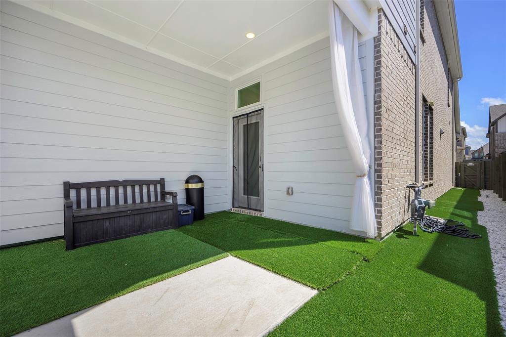 3603 Scotsman Road Sachse, TX 75048 - Photo 29 of 33 a view of a deck with a garden