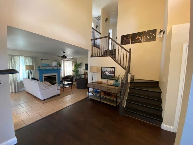 745 Haliburton Way Coalinga, CA 93210 - Photo 2 of 35 a living room with furniture and a fireplace