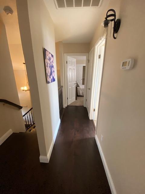 745 Haliburton Way Coalinga, CA 93210 - Photo 12 of 35 a view of a hallway view with staircase