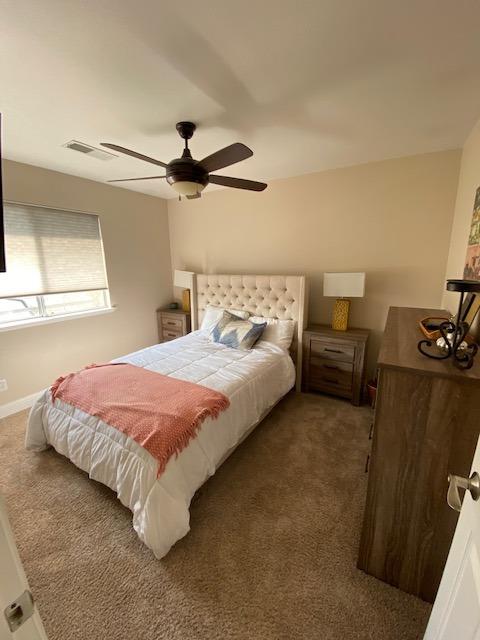 745 Haliburton Way Coalinga, CA 93210 - Photo 17 of 35 a bedroom with a bed and a night stand