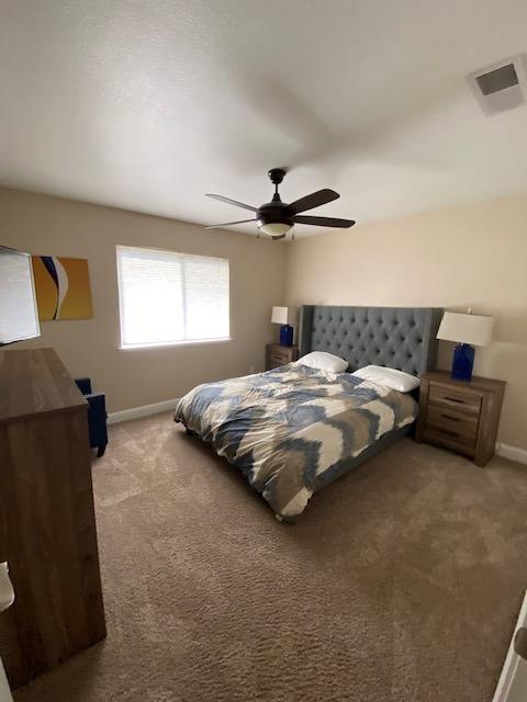 745 Haliburton Way Coalinga, CA 93210 - Photo 21 of 35 a bedroom with a bed and window