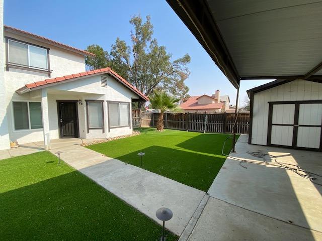 745 Haliburton Way Coalinga, CA 93210 - Photo 27 of 35 a view of a house with a yard