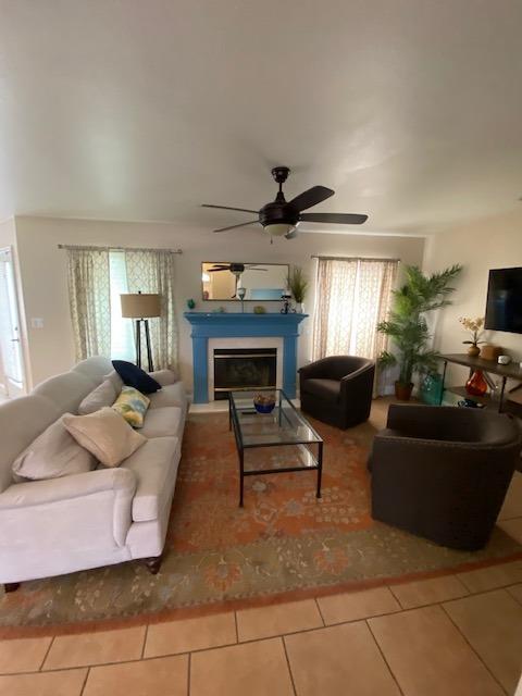 745 Haliburton Way Coalinga, CA 93210 - Photo 4 of 35 a living room with furniture and a fireplace
