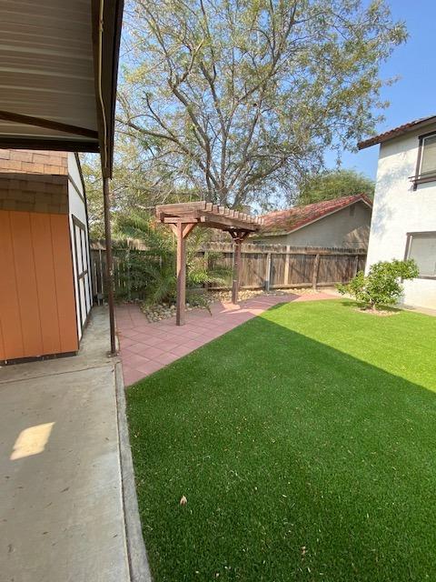 745 Haliburton Way Coalinga, CA 93210 - Photo 32 of 35 a view of a house with a yard porch and sitting area