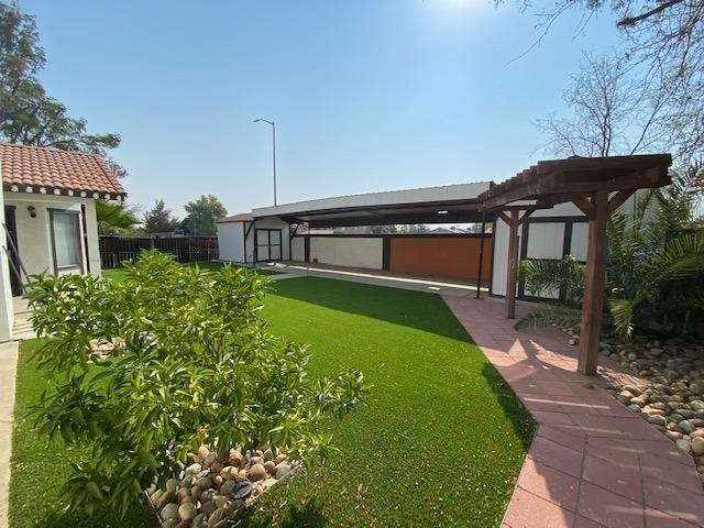 745 Haliburton Way Coalinga, CA 93210 - Photo 34 of 35 a front view of a house with garden