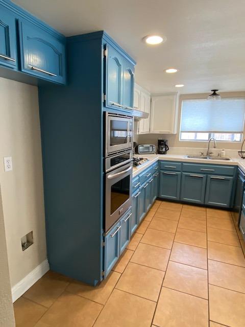 745 Haliburton Way Coalinga, CA 93210 - Photo 5 of 35 a kitchen with stainless steel appliances granite countertop a sink and cabinets
