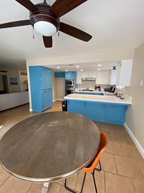 745 Haliburton Way Coalinga, CA 93210 - Photo 8 of 35 a view of a kitchen with a sink and cabinets