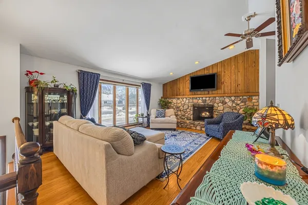 a living room with furniture fireplace and a flat screen tv