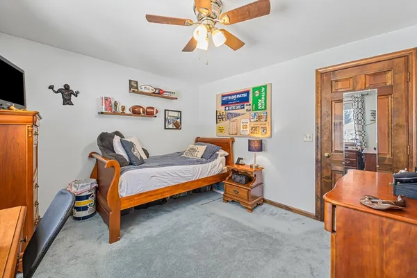 a bedroom with furniture and a window