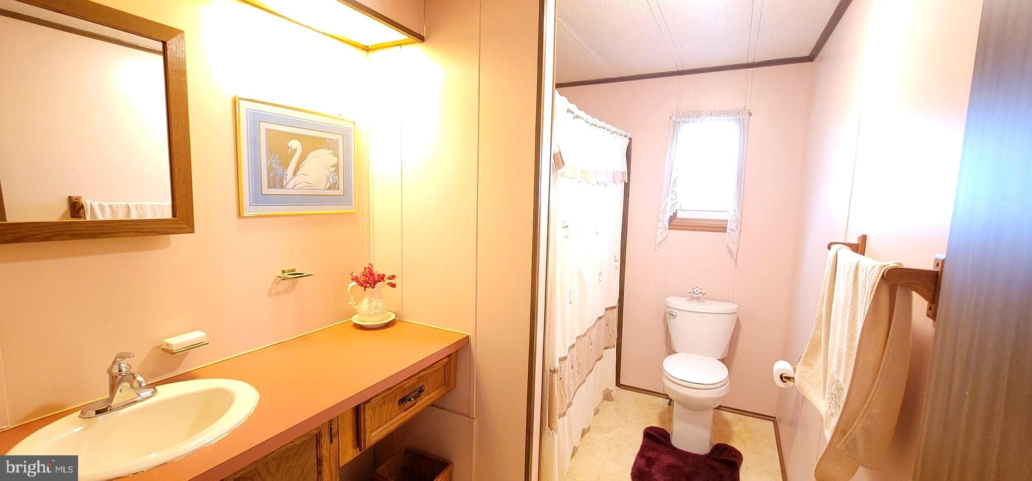 311 John Alden Drive Buena, NJ 08310 - Photo 12 of 35 a bathroom with a granite countertop sink toilet and shower