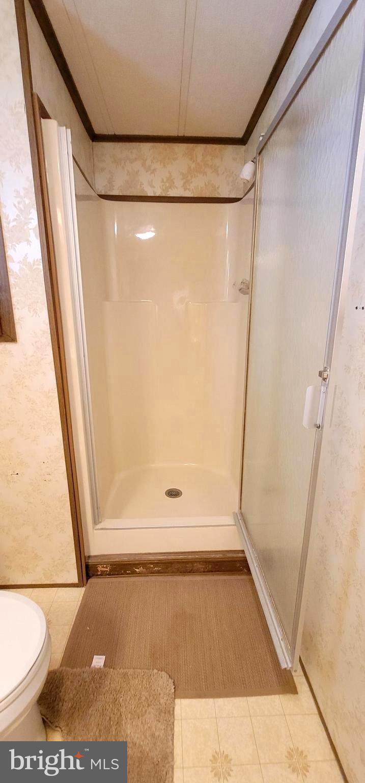 311 John Alden Drive Buena, NJ 08310 - Photo 20 of 35 a bathroom with a glass shower door