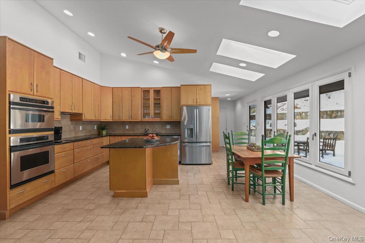20 Faraway Road Armonk, NY 10504 - Photo 6 of 26 Kitchen with island and door to rear deck