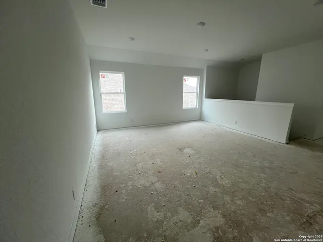 an empty room with windows