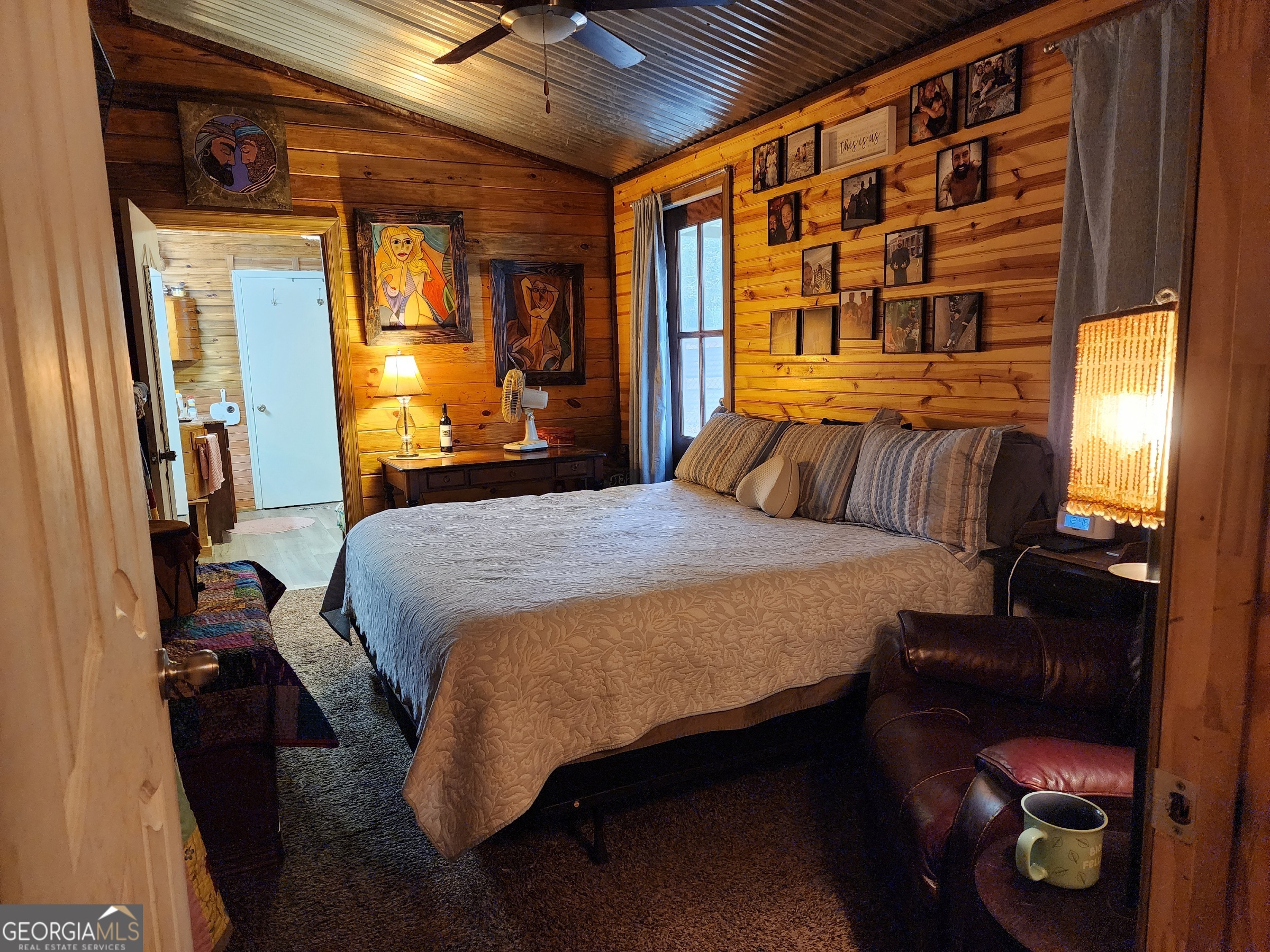 260 Old Copelan Road Southeast Eatonton, GA 31024 - Photo 15 of 88 a bedroom with a bed and dresser with mirror