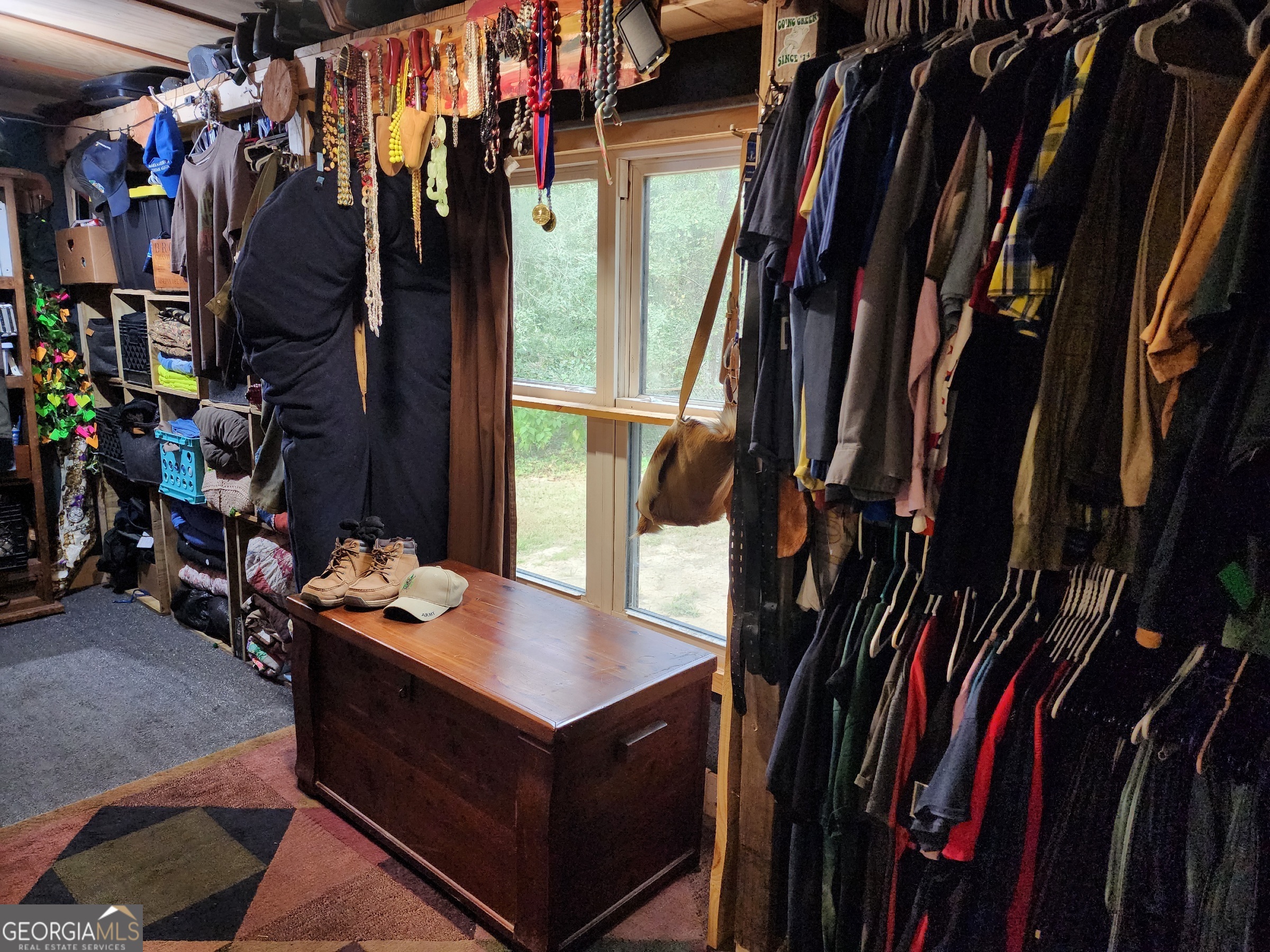260 Old Copelan Road Southeast Eatonton, GA 31024 - Photo 21 of 88 a view of walk in closet with clothes and shoes