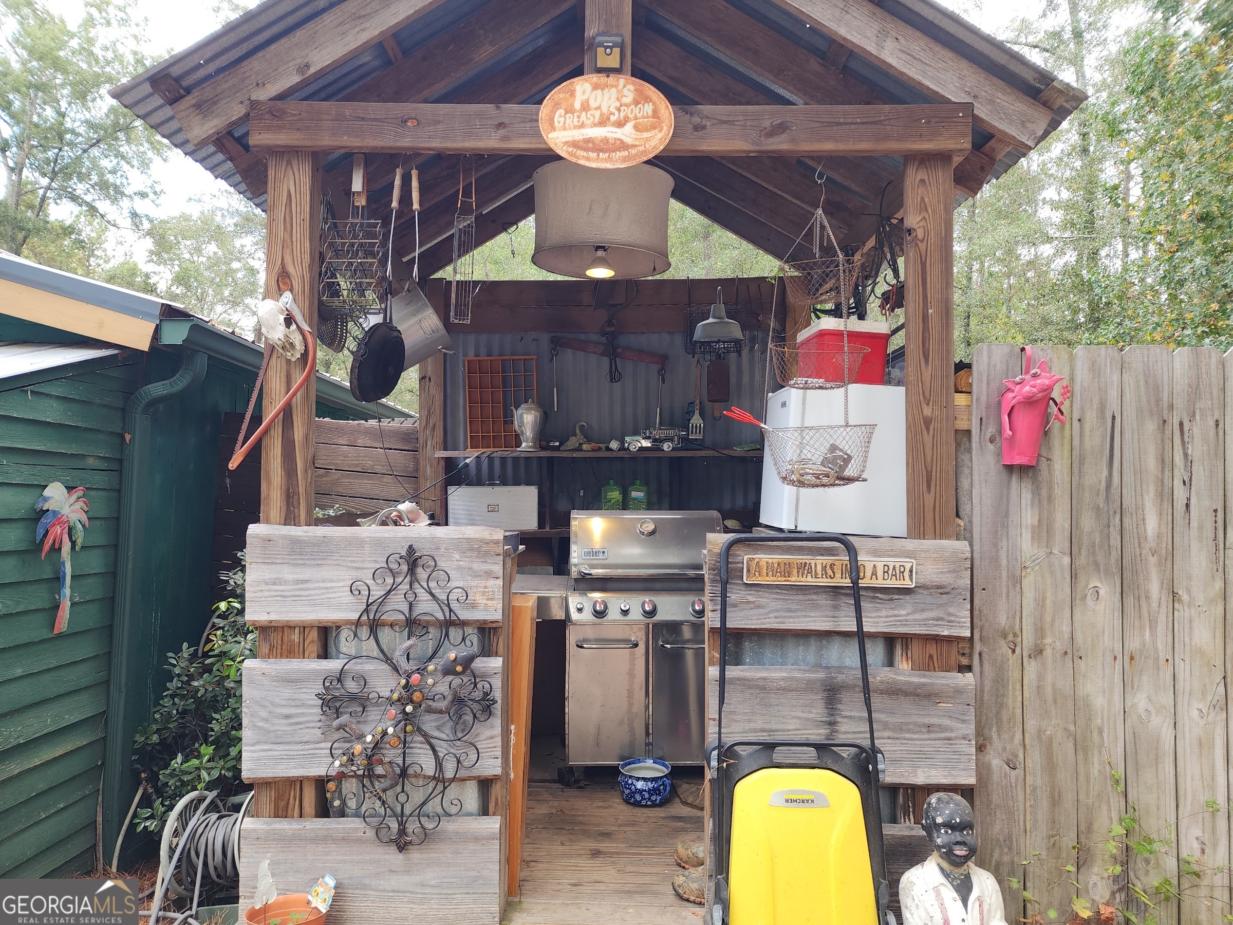 260 Old Copelan Road Southeast Eatonton, GA 31024 - Photo 4 of 88 a front view of a house with a swimming pool