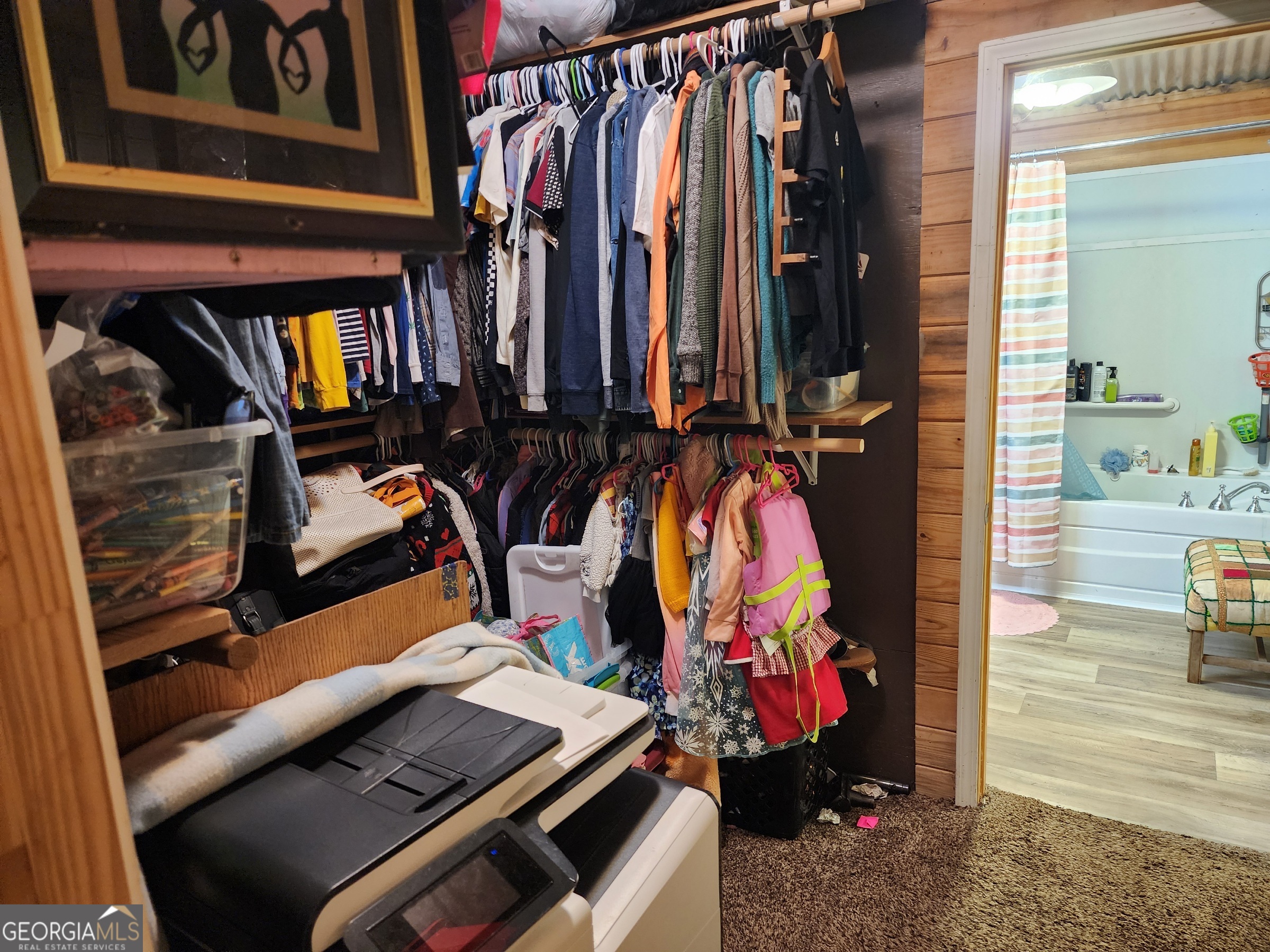 260 Old Copelan Road Southeast Eatonton, GA 31024 - Photo 42 of 88 a view of walk in closet with clothes and shoes