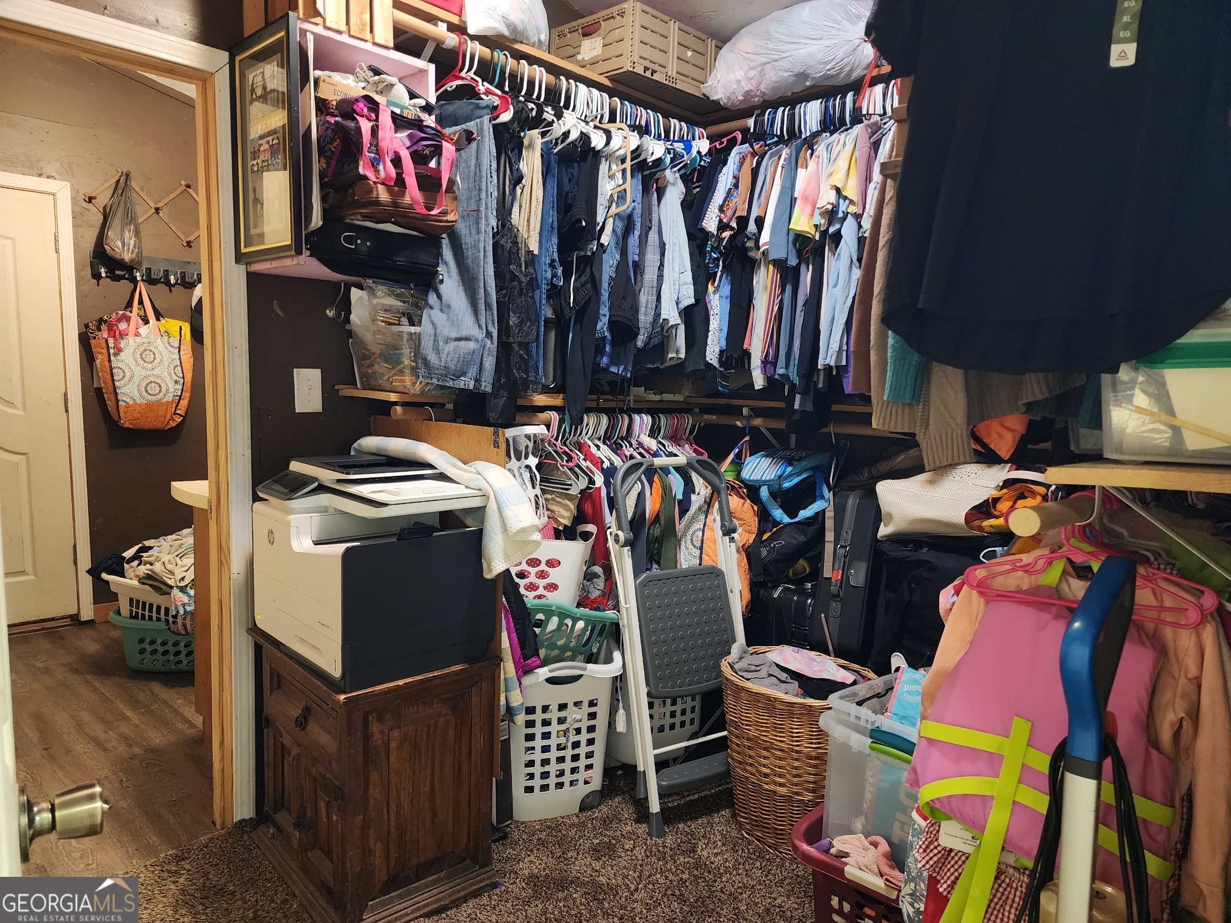 260 Old Copelan Road Southeast Eatonton, GA 31024 - Photo 43 of 88 a view of walk in closet with clothes and shoes