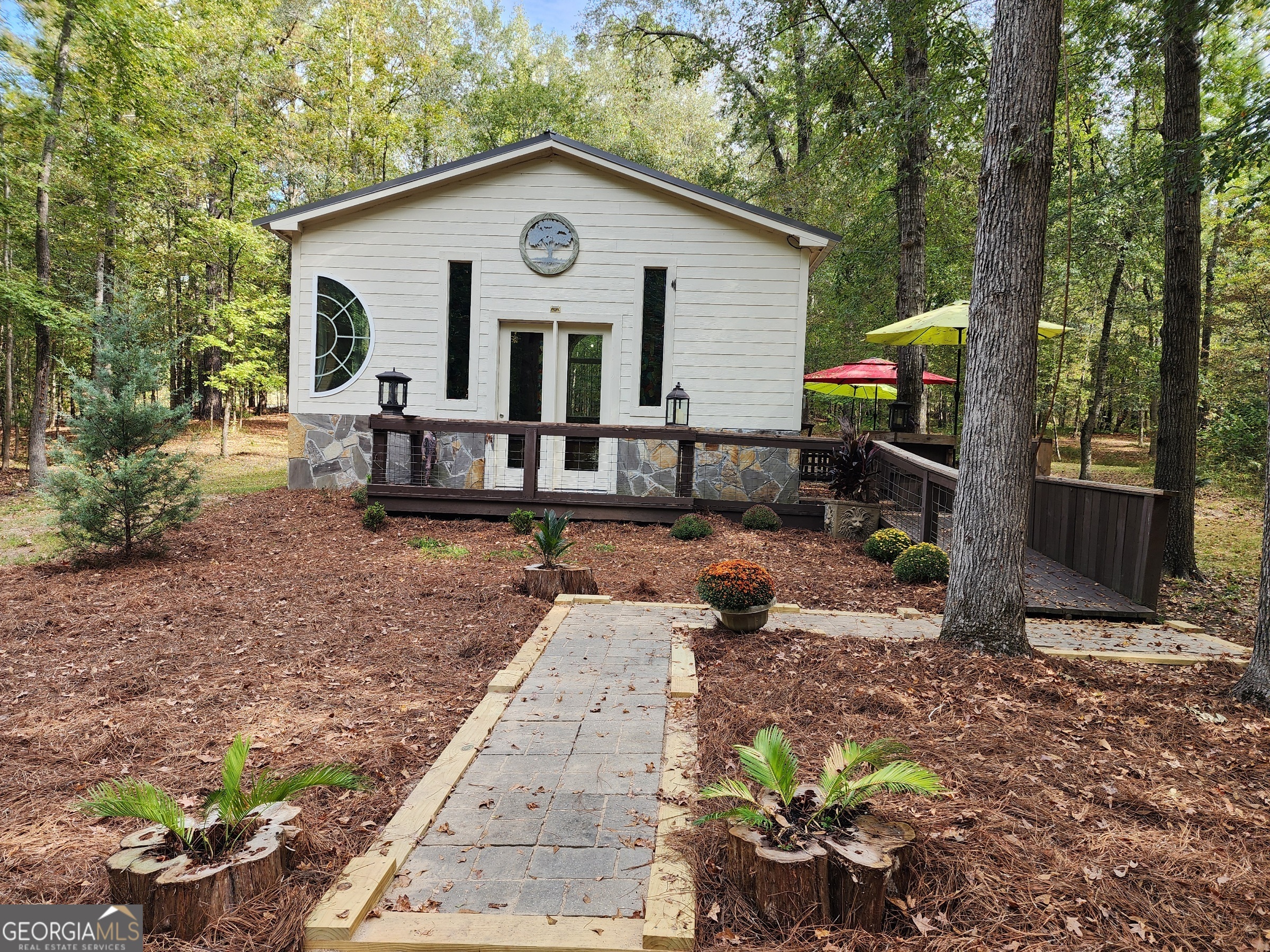 260 Old Copelan Road Southeast Eatonton, GA 31024 - Photo 44 of 88 a view of a house with a yard siting area and garden