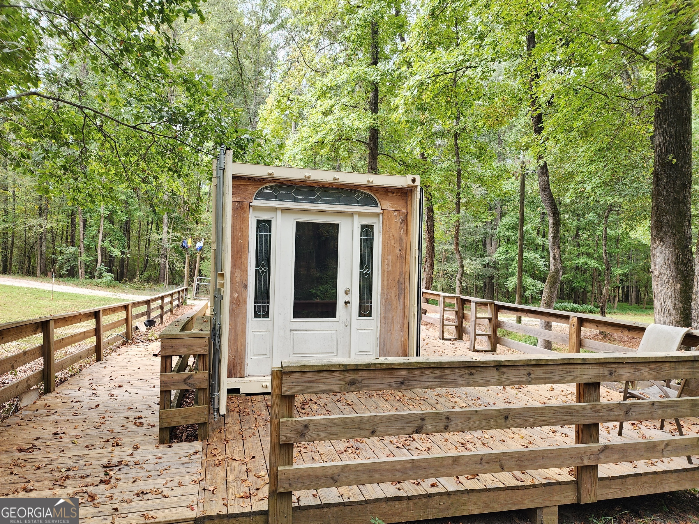 260 Old Copelan Road Southeast Eatonton, GA 31024 - Photo 53 of 88 a view of a bench in the backyard of a house