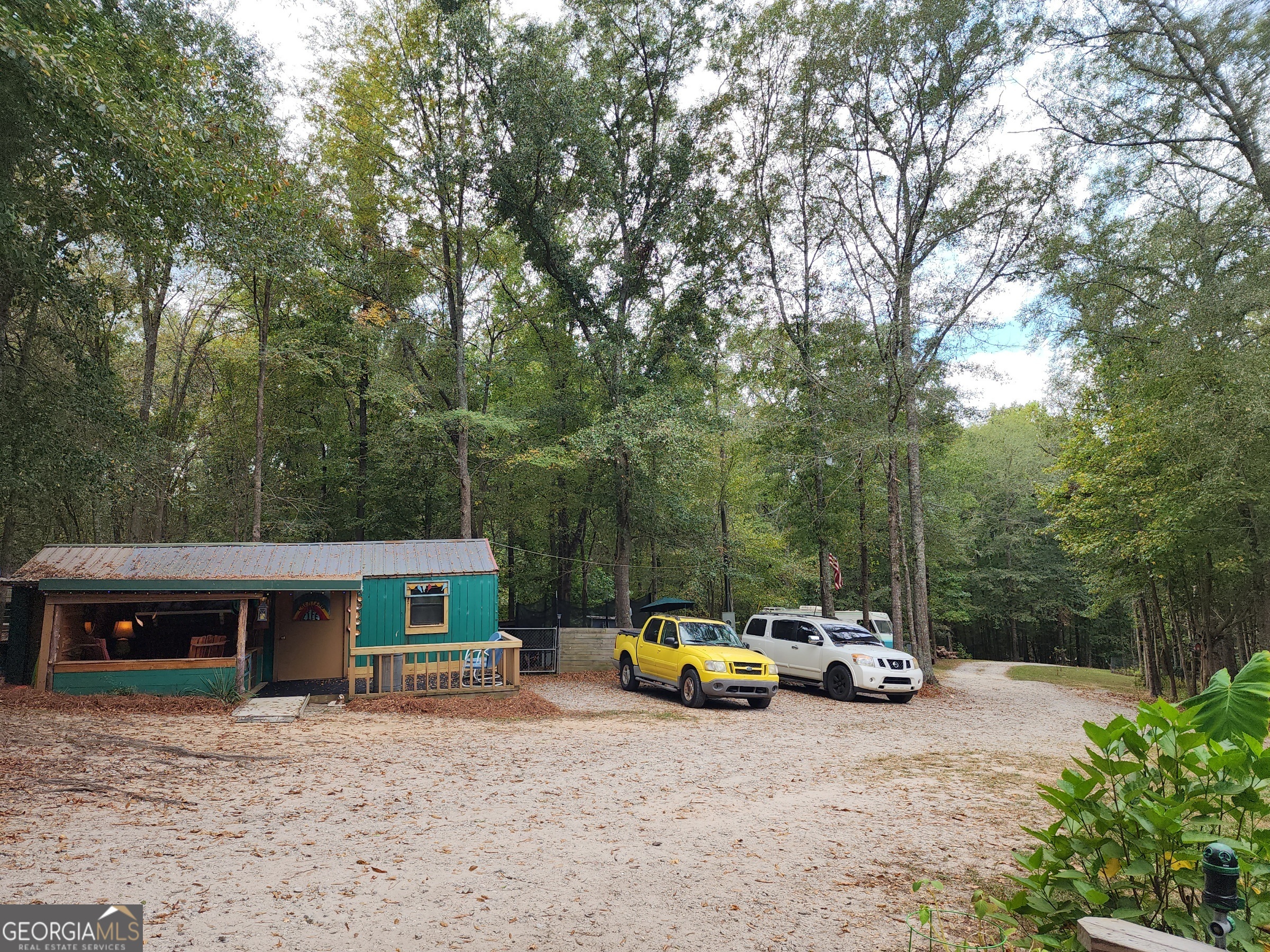 260 Old Copelan Road Southeast Eatonton, GA 31024 - Photo 58 of 88 a view of a house with truck parked on the road