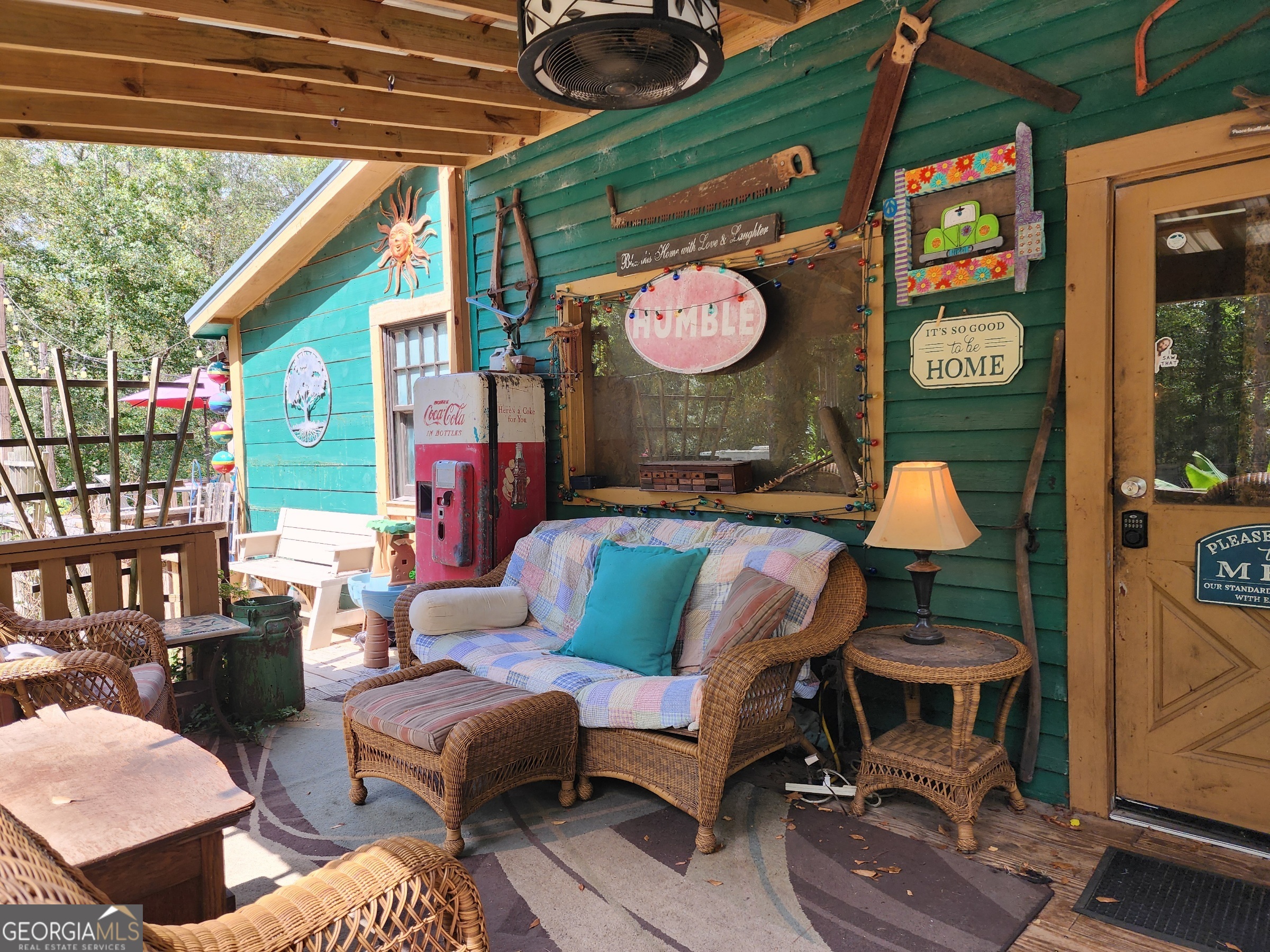 260 Old Copelan Road Southeast Eatonton, GA 31024 - Photo 6 of 88 a outdoor living space with furniture and a fireplace