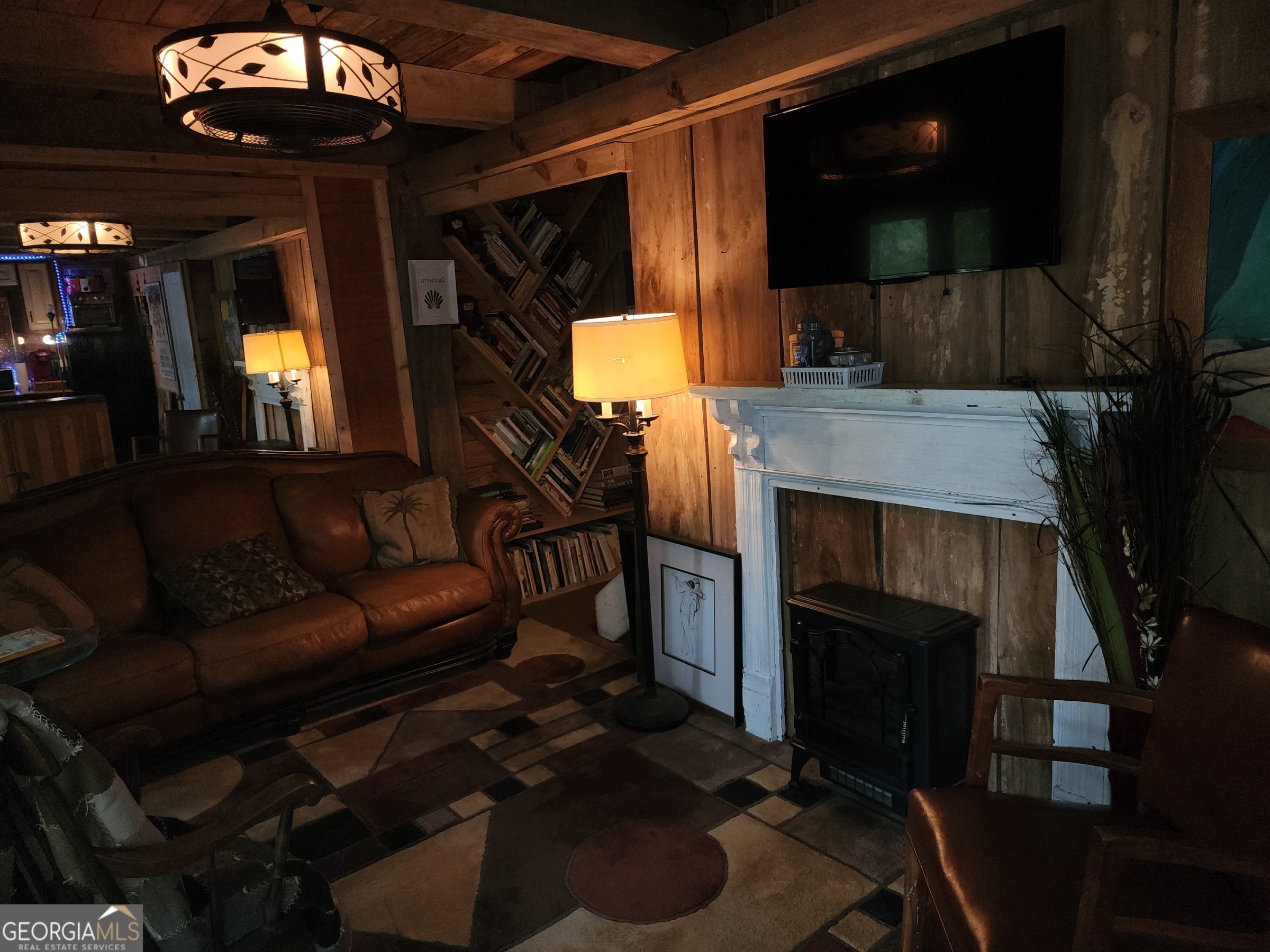 260 Old Copelan Road Southeast Eatonton, GA 31024 - Photo 70 of 88 a living room with furniture and a fireplace