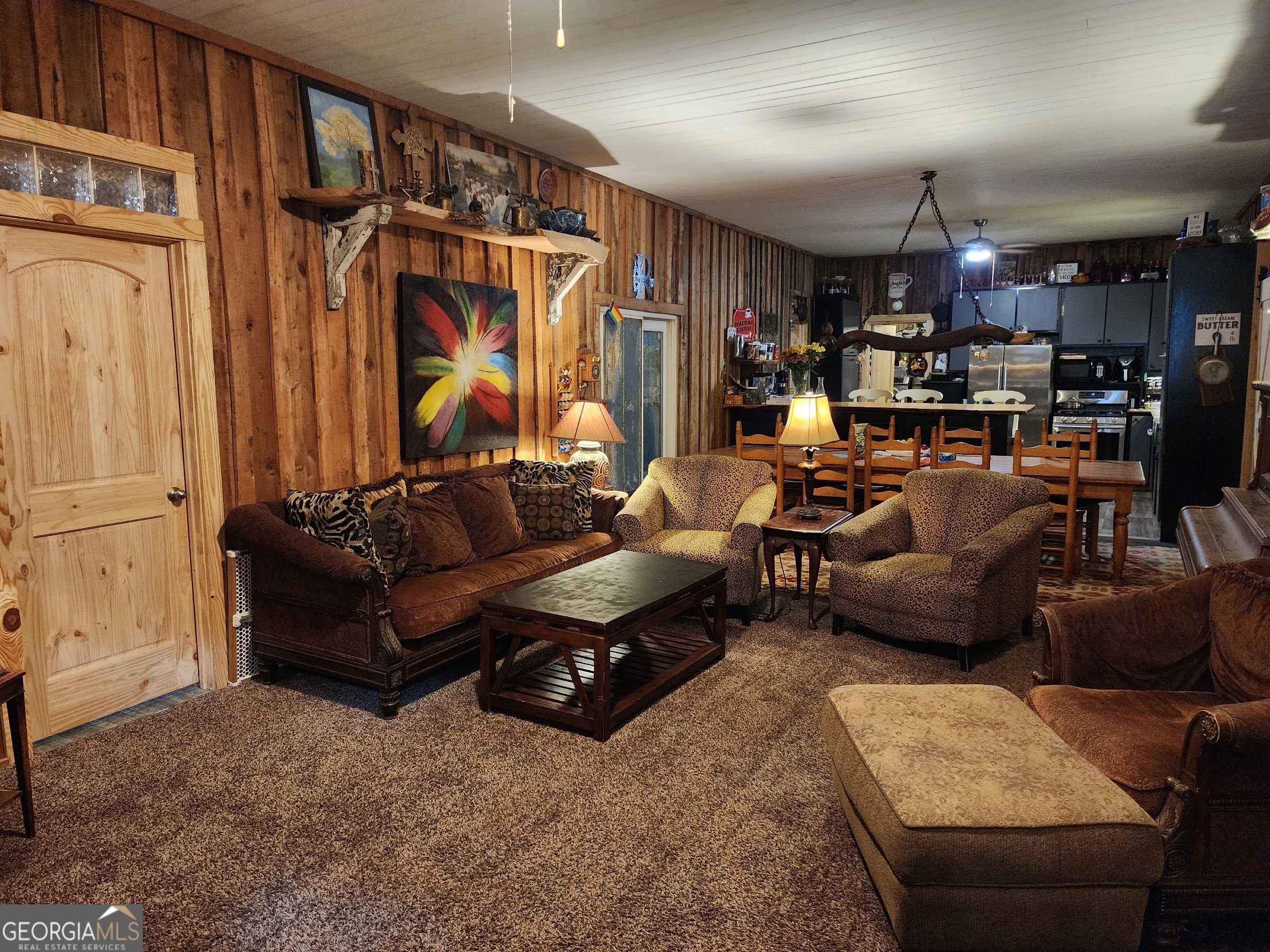 260 Old Copelan Road Southeast Eatonton, GA 31024 - Photo 8 of 88 a living room with furniture kitchen view and a chandelier