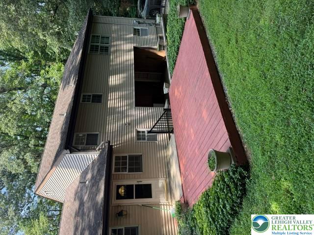 2045 Church Road Bethlehem, PA 18015 - Photo 13 of 42 A robust elevated deck connects seamlessly to the dwelling, offering an inviting outdoor living space.