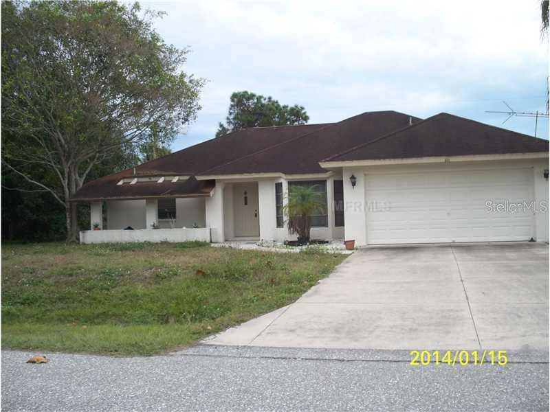 571 Coronado Road Venice, FL 34293 - Photo 1 of 1 a front view of a house with a yard and garage