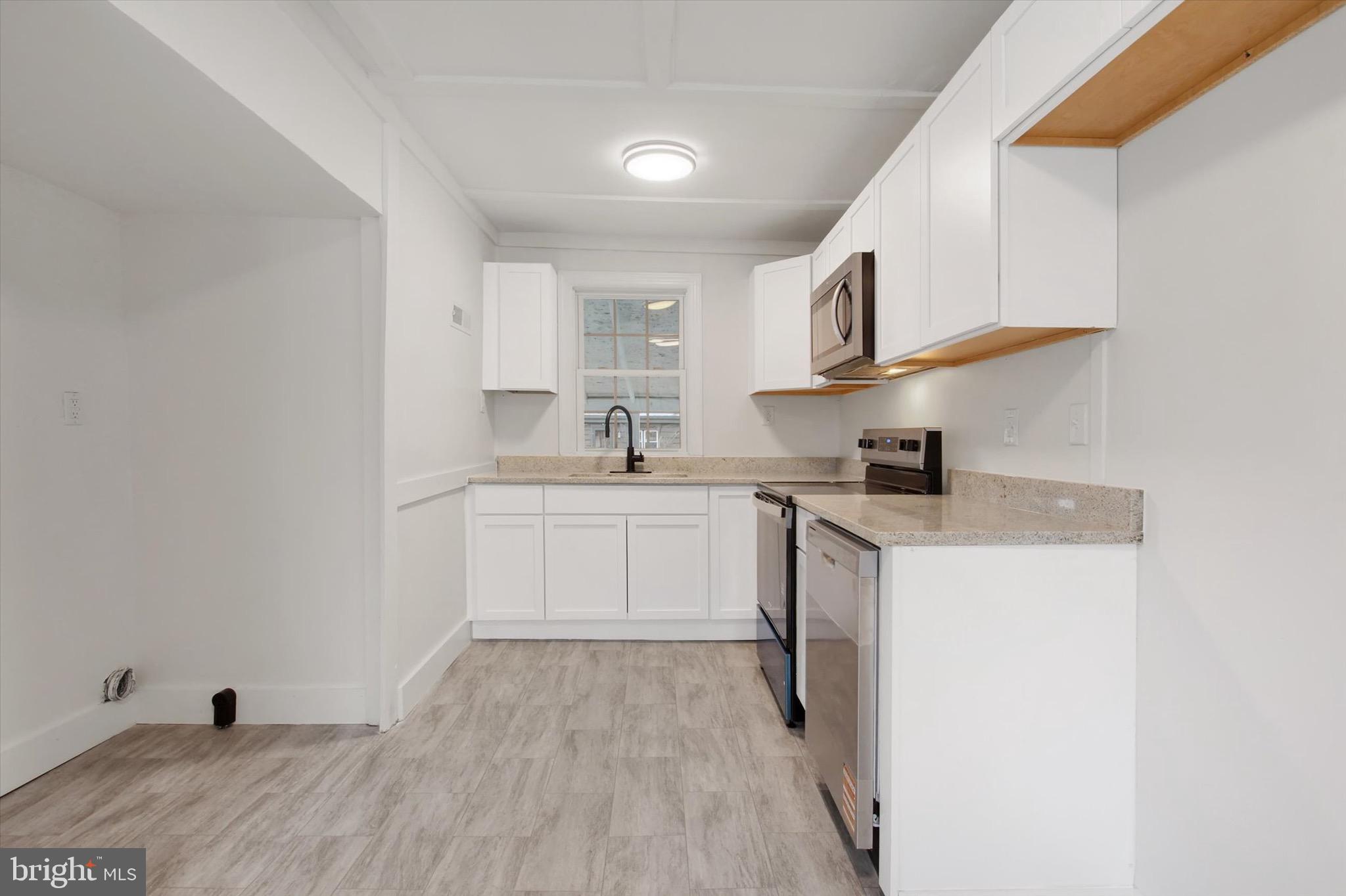 2515 Mummasburg Road Gettysburg, PA 17325 - Photo 12 of 22 a kitchen with cabinets a sink and appliances