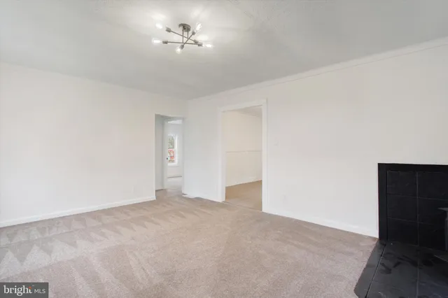a view of empty room with ceiling fan