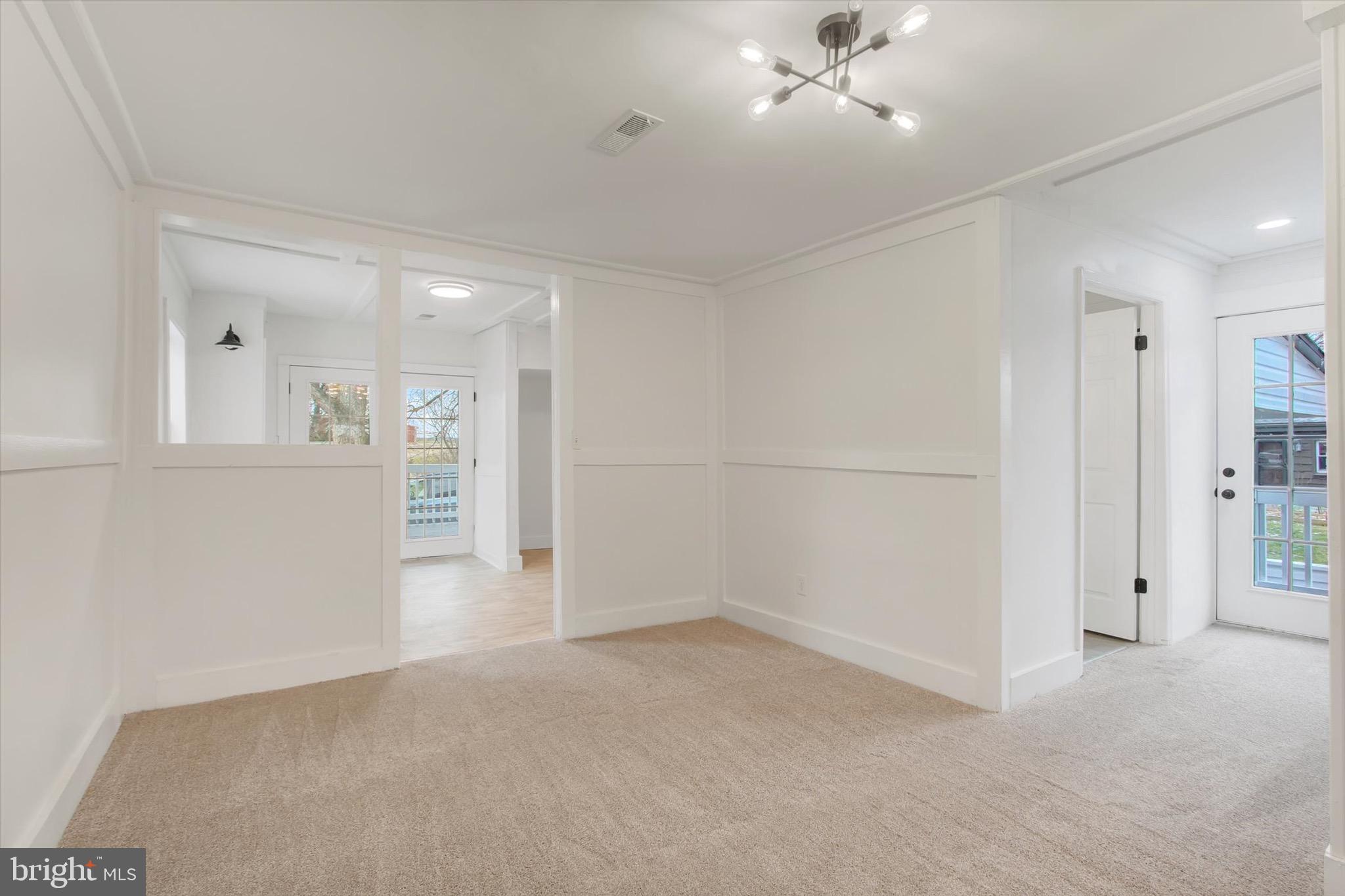 2515 Mummasburg Road Gettysburg, PA 17325 - Photo 7 of 22 an empty room with an entryway and fan