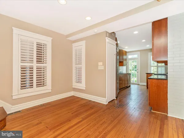 a view of an entryway with wooden floor and stairs