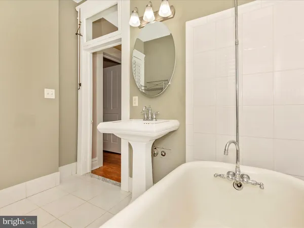 a view of a house with a yard and furniture