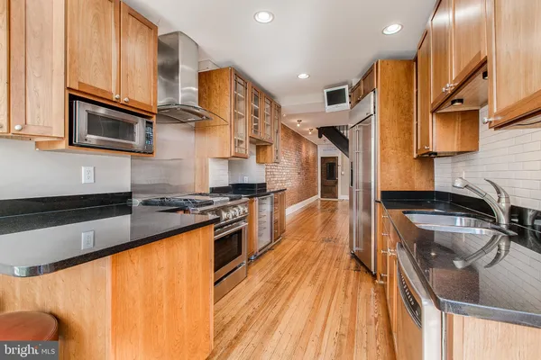 a view of a lake with chairs and umbrellas