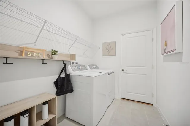 a utility room with dryer and washer