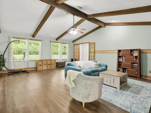 a living room with furniture and a large window