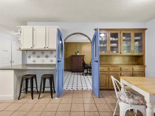 a view of a kitchen with a sink and cabinets