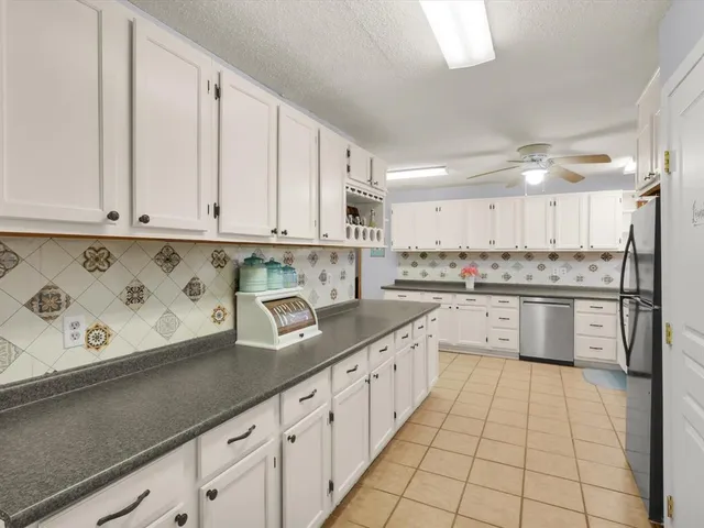 a kitchen with a cabinets and window
